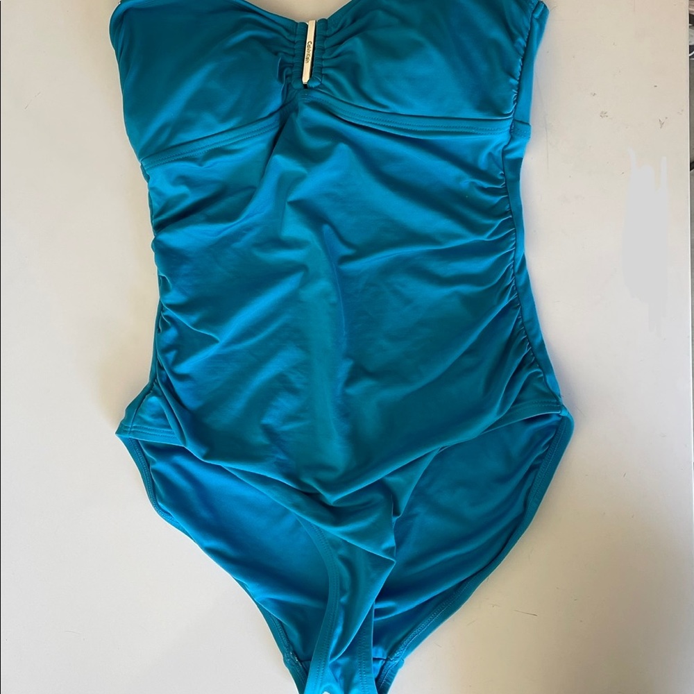 Blue. Calvin Klein bathing suit. Never used. No stains no rips. Size 6